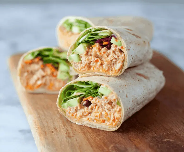 Delicious spicy tuna wraps filled with fresh ingredients and colorful vegetables, perfect for a flavorful snack or meal.