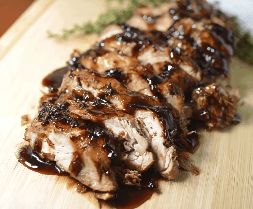 Juicy pork tenderloin glazed with sweet brown sugar and tangy balsamic vinegar, cooked in a slow cooker for a flavorful Crockpot Brown Sugar Balsamic Glazed Pork Tenderloin