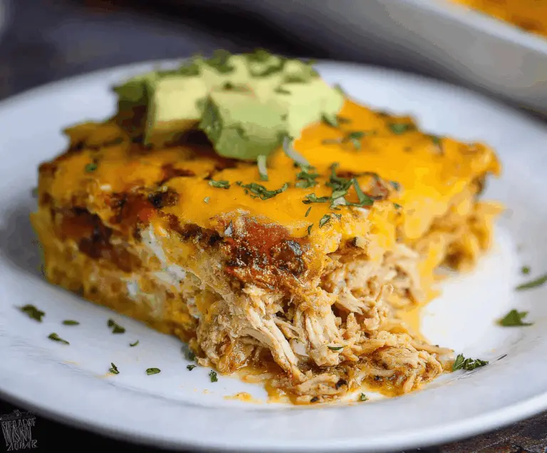 Delicious keto Mexican chicken casserole topped with cheese and fresh cilantro, perfect for low-carb Mexican-inspired meals.