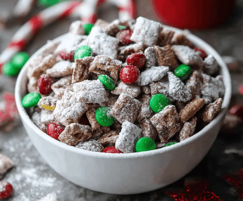Festive Christmas Puppy Chow with colorful coated cereal snack in holiday bowl