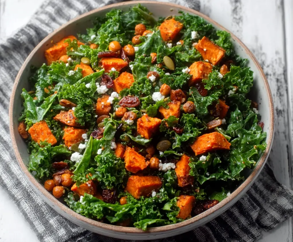 Vibrant kale and roasted sweet potato salad in a bowl, perfect for healthy eating.