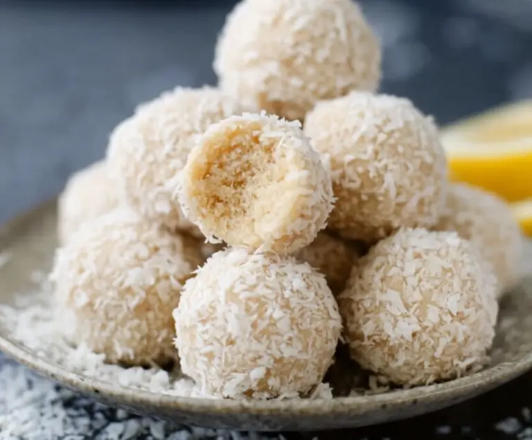 Delicious lemon coconut protein balls on a white plate, perfect for a healthy snack
