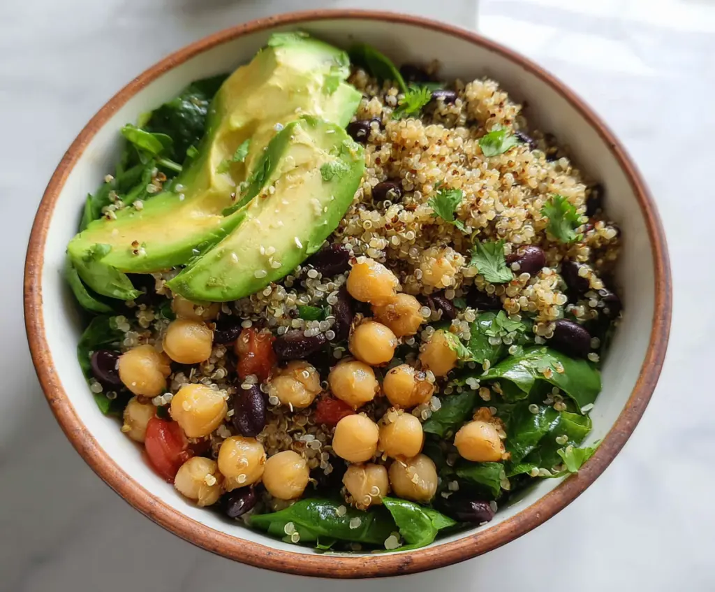 Healthy quinoa bowl with fresh avocado slices and seasoned chickpeas ideal for a nutritious meal.