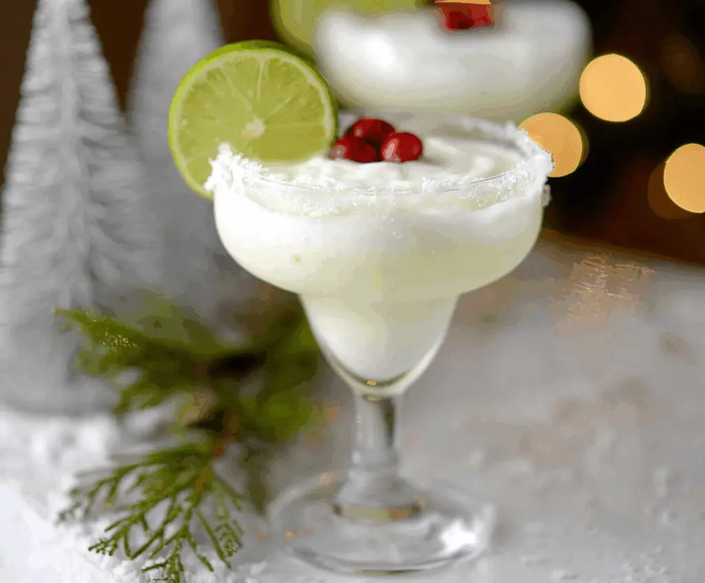 Refreshing White Christmas Margarita in a festive glass with snowflake-shaped garnish