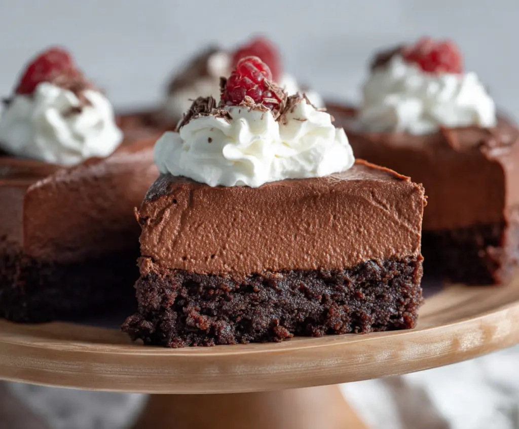 Delicious Chocolate Mousse Brownies with a rich, velvety topping and fudgy brownie base.