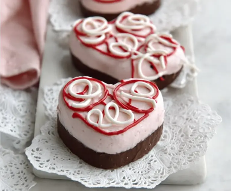 Delicious Copycat Little Debbie Valentines Cakes with pink frosting and festive sprinkles.