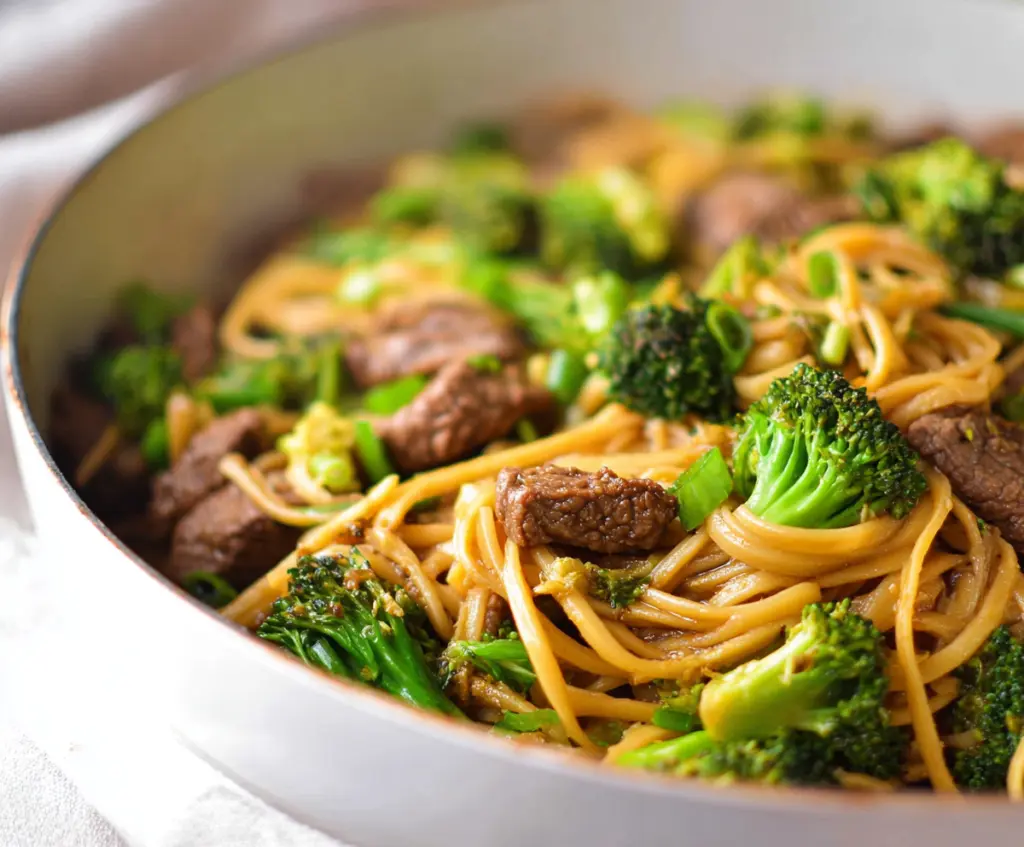 Delicious Garlic Ginger Beef and Broccoli Noodles with tender beef and fresh vegetables