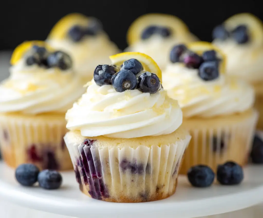 Delicious Lemon Blueberry Cupcakes topped with fresh blueberries and lemon zest, perfect for summer desserts.